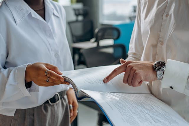 Business professionals reviewing a document in an office