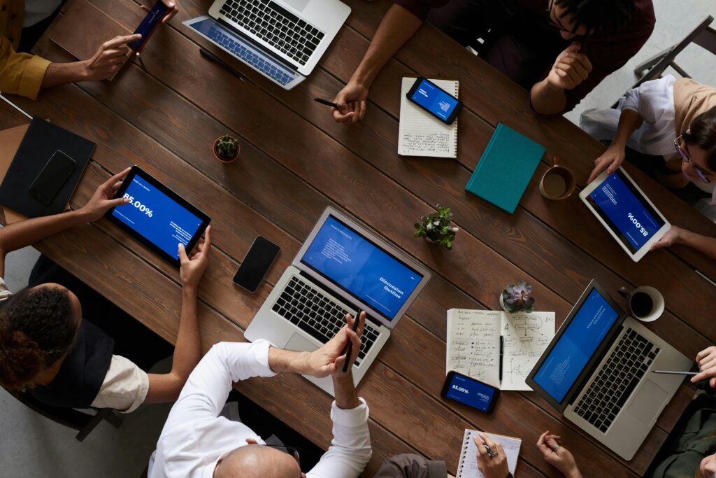 Overhead view of business professionals working together on vCIO Services