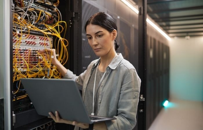 Cloud engineer analyzing data for Azure cost optimization in a modern datacenter.